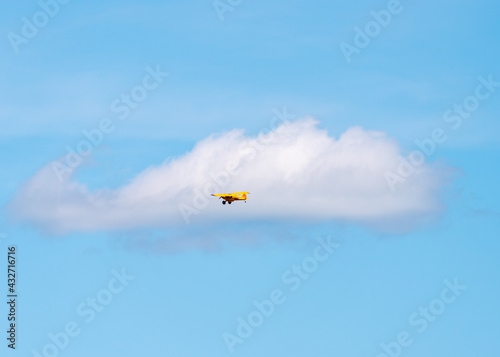 Little Yellow Plane Against the Blue Sky