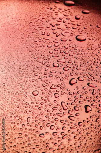 Abstract background with water drops on a copper surface