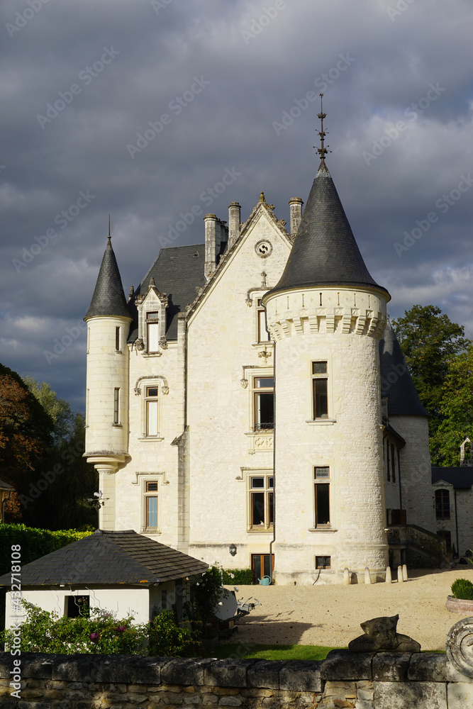 old limestone castle with stormy sky in the Loire valley, France