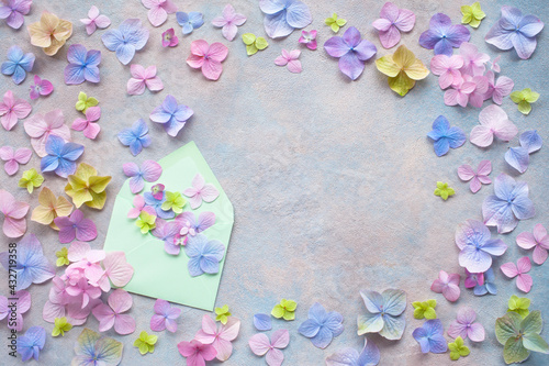 Decorative background with colored hydrangea flowers, space for your text congratulations and an envelope. photo