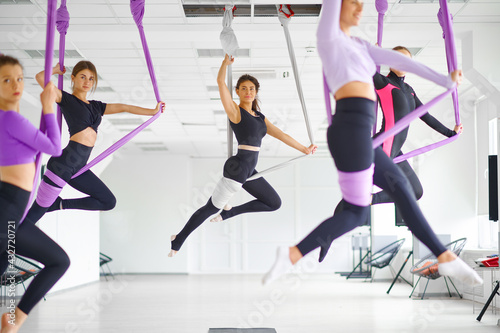 Fototapeta Naklejka Na Ścianę i Meble -  Fly yoga class, hanging on hammocks
