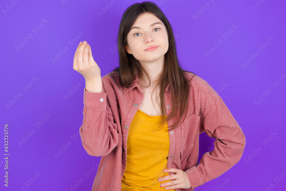 What the hell are you talking about. Shot of frustrated young beautiful Caucasian woman gesturing with raised hand doing Italian gesture, frowning, being displeased and confused with dumb question. What the hell are you talking about. Shot of frustrated young beautiful Caucasian woman gesturing with raised hand doing Italian gesture, frowning, being displeased and confused with dumb question.