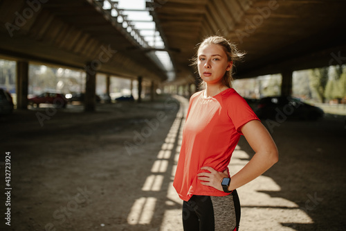 Beautiful fitness model girl posing wearing sport clothes. Girl in the sport concept.