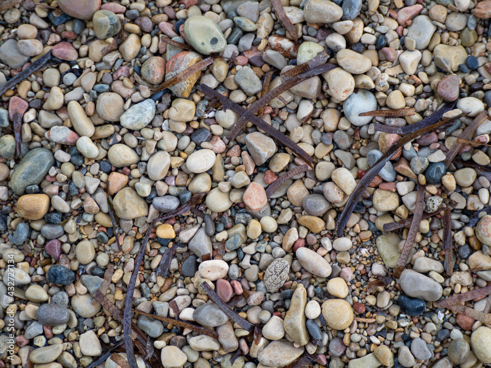 background of stones round edge of beach and river background of stones round edge of beach and river