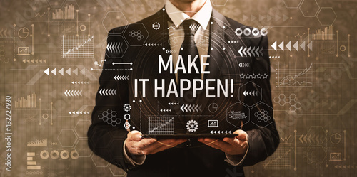 Make it happen with businessman holding a tablet computer