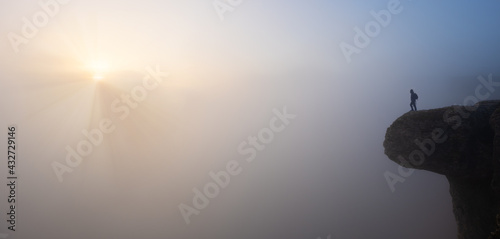 man on the edge of the cliff with the sun at dawn, Balcon de Pilatos, Sierra de Urbasa, Navarra