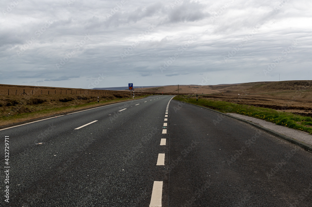 Standing in a lay-by looking down the A628 main road which runs through the middle of Peak District National Park in Derbyshire, UK