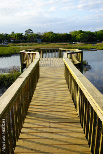 A wooden walkway over the marsh in Folly Beach SC, just south of Charleston © zimmytws