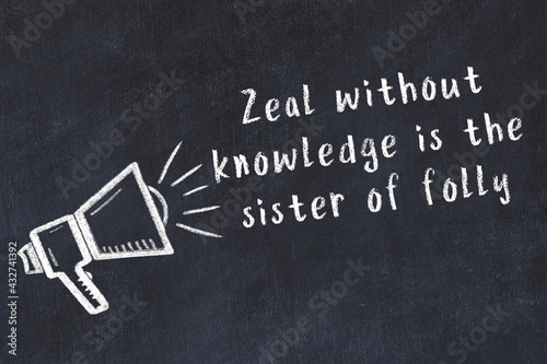 Tableau sur toile Chalk sketch of loudspeaker on black desk and movitational quote