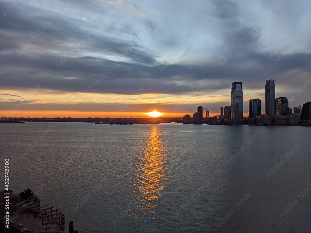Sunset over the Hudson River and Jersey City from Manhattan, New York City, NY - April 2021