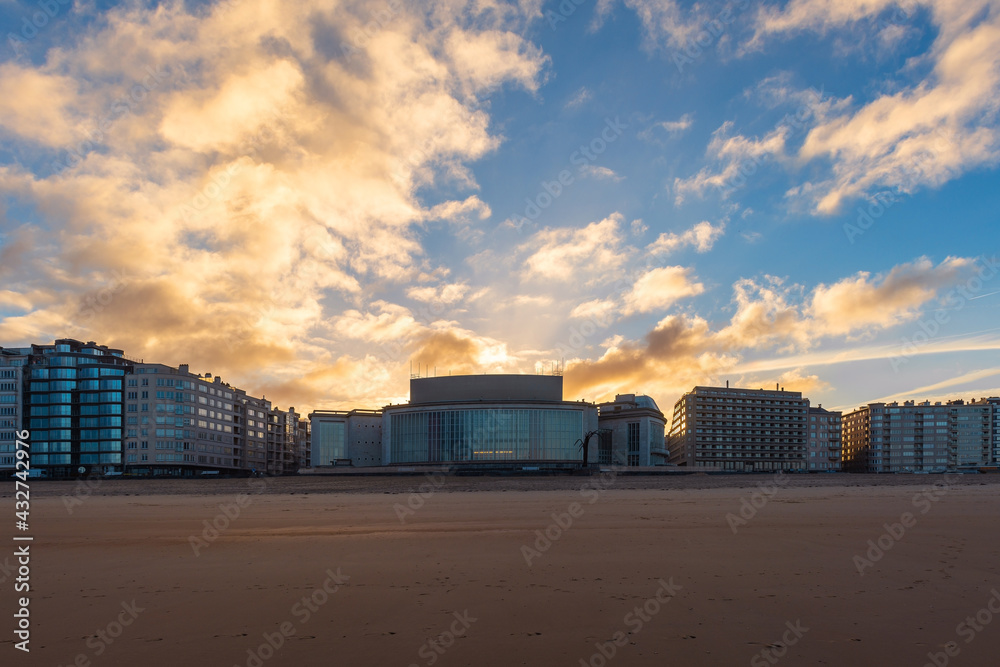Oostende (Ostend) city skyline at with North Sea beach and waterfront promenade at sunrise, Flanders, Belgium.