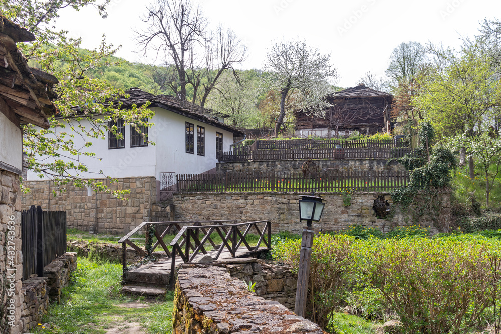 Fototapeta premium Typical street and old houses at historical village of Bozhentsi, Bulgaria