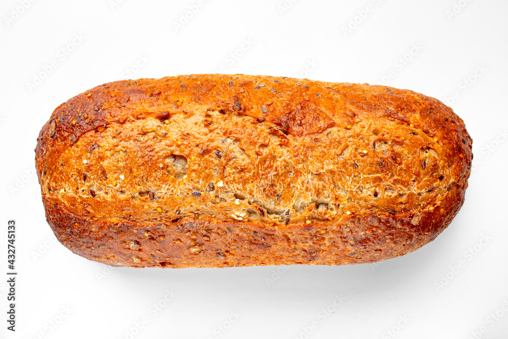 Top view of a Bakery Artisan Bread, Harvest Grain Oval on a white table. Top view of a Bakery Artisan Bread, Harvest Grain Oval on a white table.