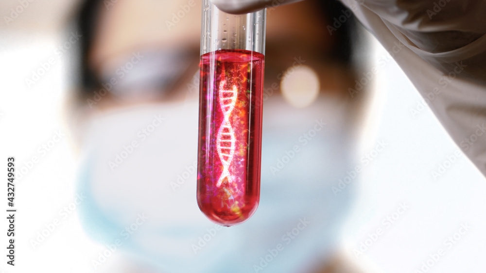 Female scientist check the DNA rotate in the test tubes in laboratory. Female scientist check the DNA rotate in the test tubes in laboratory.
