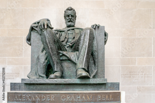 Brantford, On, Canada - May 8, 2021: The Alexander Graham Bell statue by A. E. Cleeve Horne in front of the Bell Telephone of Canada Building in Brantford, Ontario, Canada.  photo