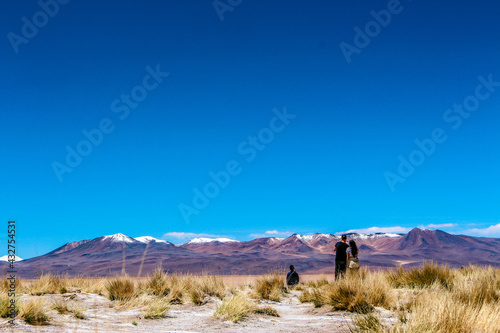 Blue lake and the mountains with snow on top at Salar de Chalviri, Bolívia  © Letícia Rodrigues