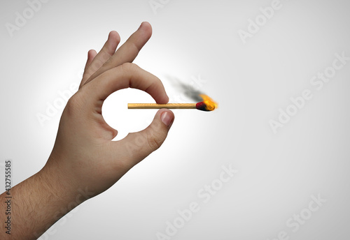 Incendiary Speech and social media rhetoric inciting public opinion or cancel culture concept as a hand shaped as a word bubble holding a flaming match