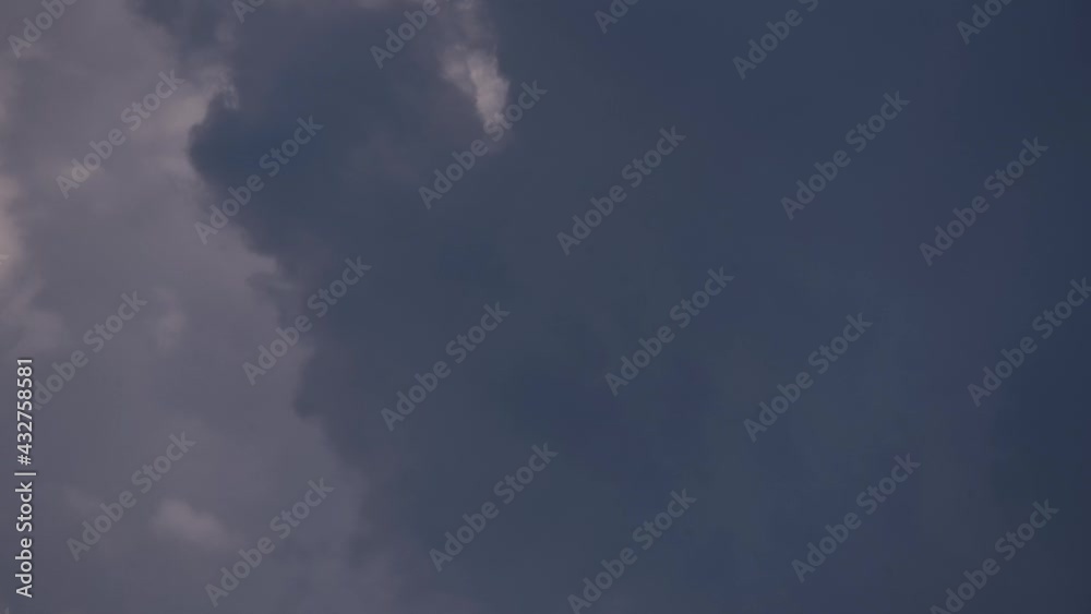 4K Time lapse, Gray and white rolling puffy clouds floating in the sky. 4K Time lapse, Gray and white rolling puffy clouds floating in the sky.