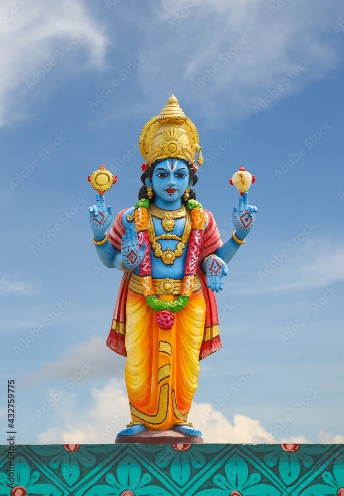 Hindu god Perumal statue on temple tower