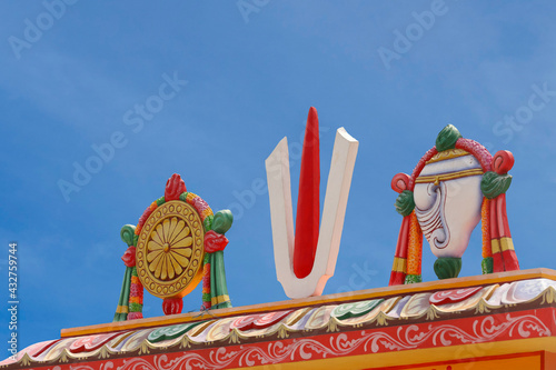 Perumal Naama statue with Shanku and Chakra on Temple tower	
