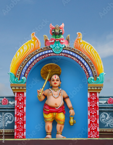 Vamana avatar of  Vishnu statue on temple tower photo