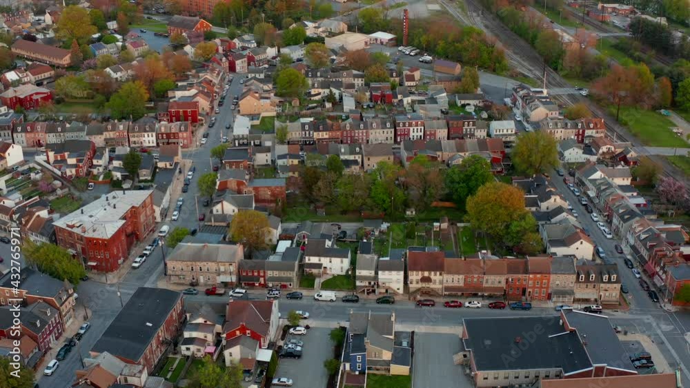 Aerial of historic old town. City homes and houses, business line the streets during evening dusk, morning dawn shot. Aerial of historic old town. City homes and houses, business line the streets during evening dusk, morning dawn shot.