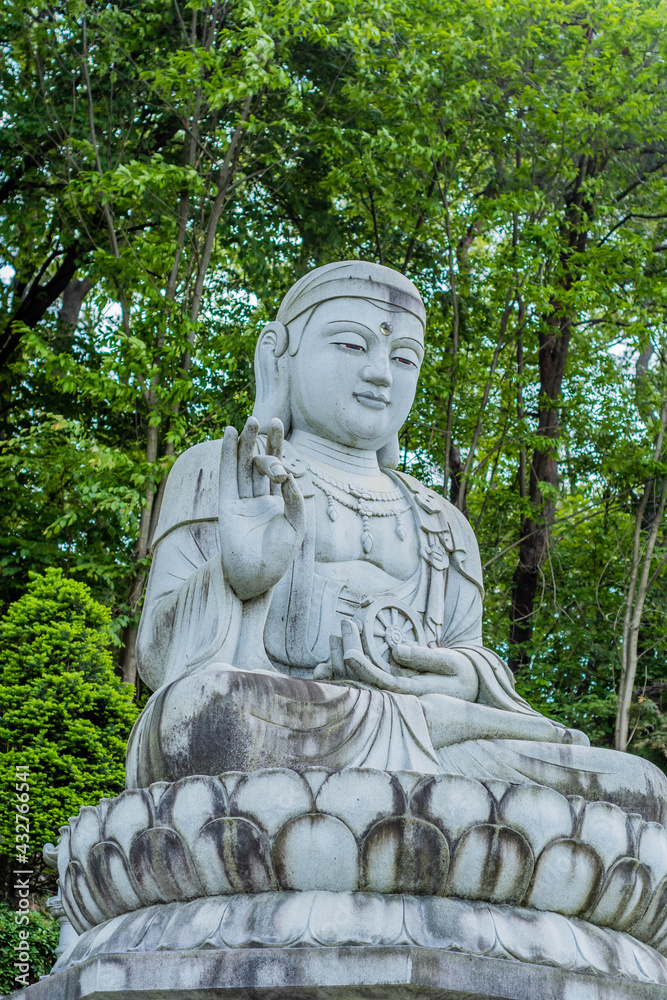 Seated Buddha on lotus flower plinth Seated Buddha on lotus flower plinth