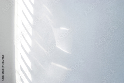 Architectural shadows. Sunlight architecture abstract background with light, black shadow overlay from window on white texture wall. Mockups, posters, stationary, wall art, design presentation. photo