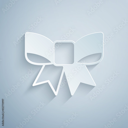 Paper cut Gift bow icon isolated on grey background. Paper art style. Vector