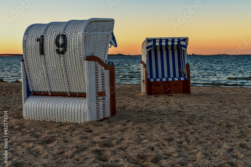 Fototapeta Naklejka Na Ścianę i Meble -  Evening at the Baltic Sea, with Beach chairs and the beach in Hohen Wieschendorf, Mecklenburg-Western Pomerania, Germany