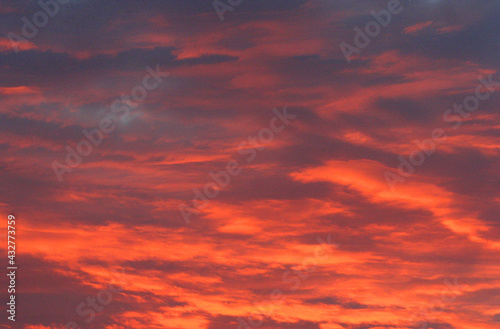 Amazing red clouds on sunrise sky view