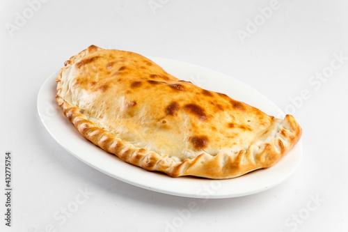 Photos Isolated plate of calzone Italian folded pizza on the white background