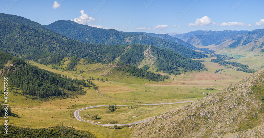 View from the pass to the valley in the Altai mountains, summer day