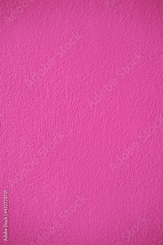 Pink cement wall texture for background and copy space for text. Pink paper background.