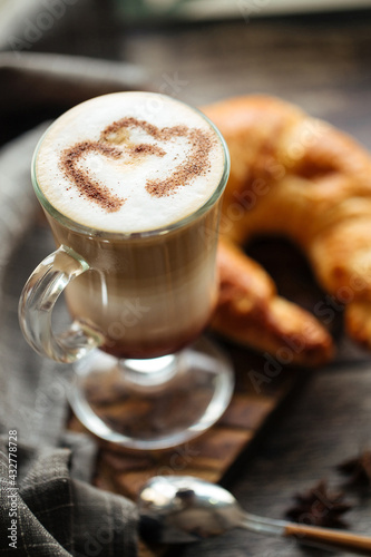 Fototapeta Naklejka Na Ścianę i Meble -  Breakfast with french croissant and mug of coffee latte