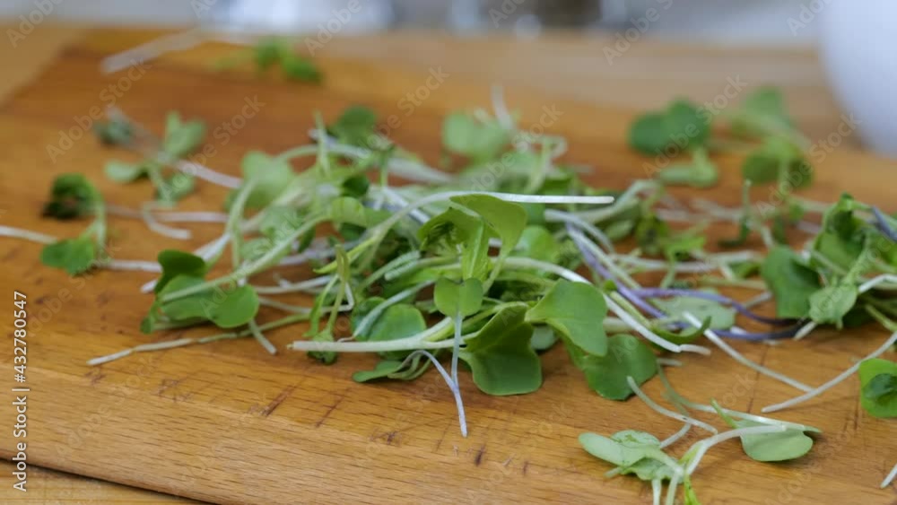 Zooming in on micro greens falling onto a counter Zooming in on micro greens falling onto a counter