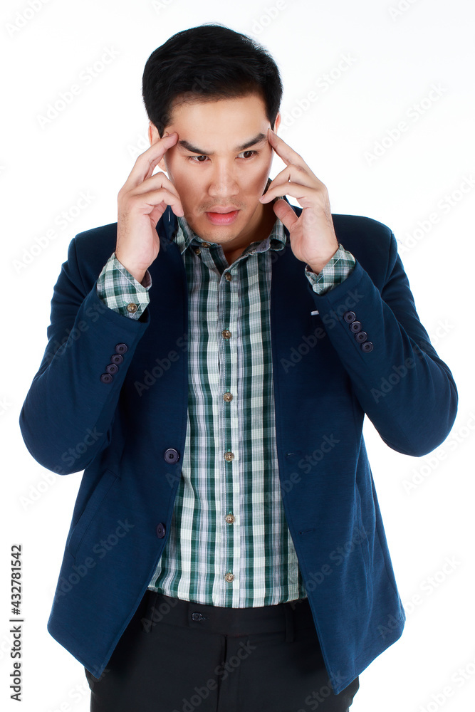 Portrait of a serious young businessman in dark blue suit with fingers rubbing on his temple, suffering from a terrible headache caused by business mistaken decision. Business concept. Portrait of a serious young businessman in dark blue suit with fingers rubbing on his temple, suffering from a terrible headache caused by business mistaken decision. Business concept.