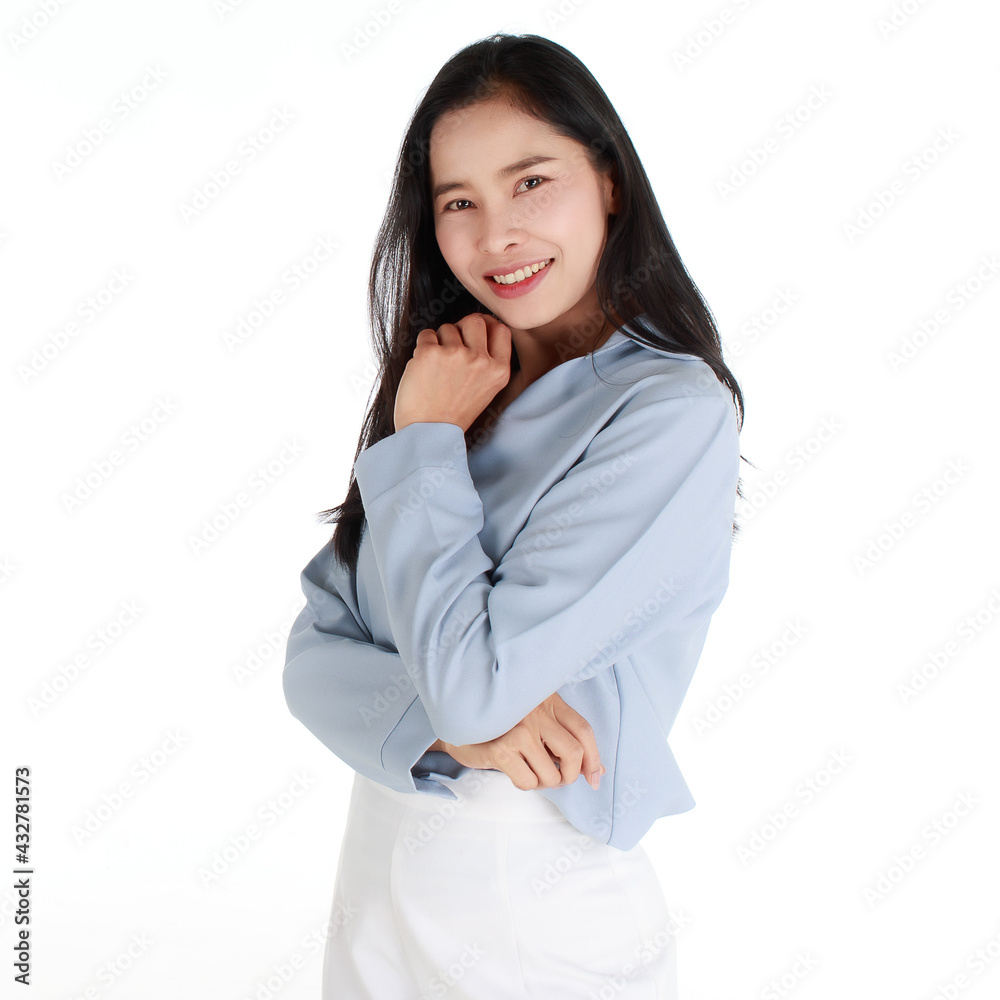 Close-up portrait of a smiling delightful elegant female in a casual light grey apparel with her arms crossed on chest looking at camera on white background. Close-up portrait of a smiling delightful elegant female in a casual light grey apparel with her arms crossed on chest looking at camera on white background.