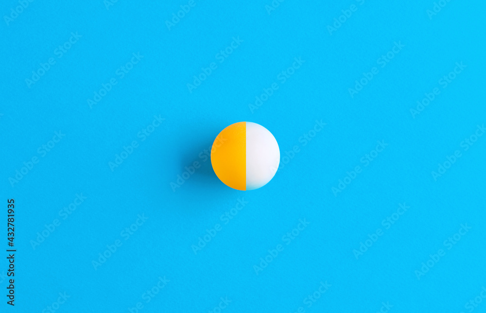 Ball halved into two different colors on blue background. Dissociative identity disorder Ball halved into two different colors on blue background. Dissociative identity disorder