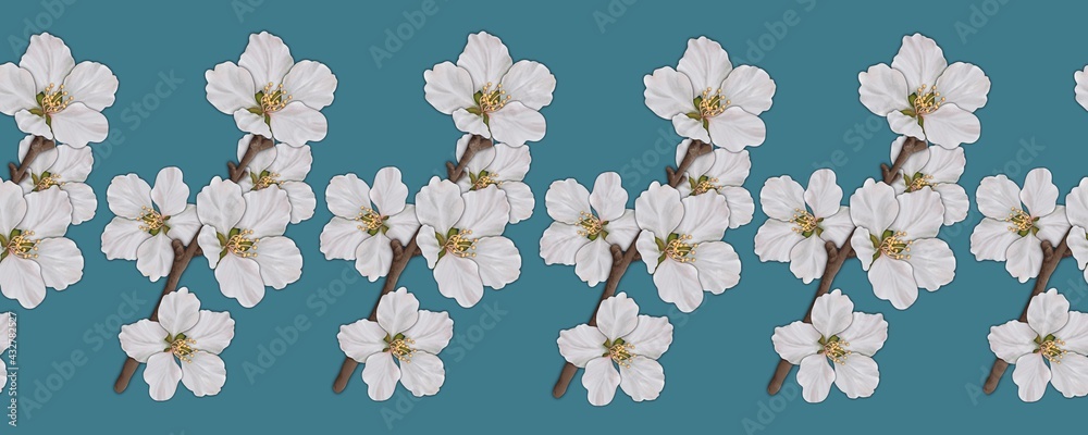 Seamless border, pattern with cherry blossoms on twigs on a blue background