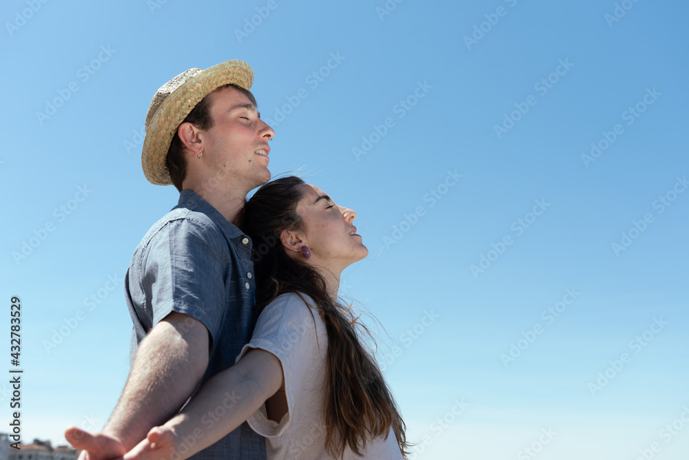 Young couple breathing and relaxing together.