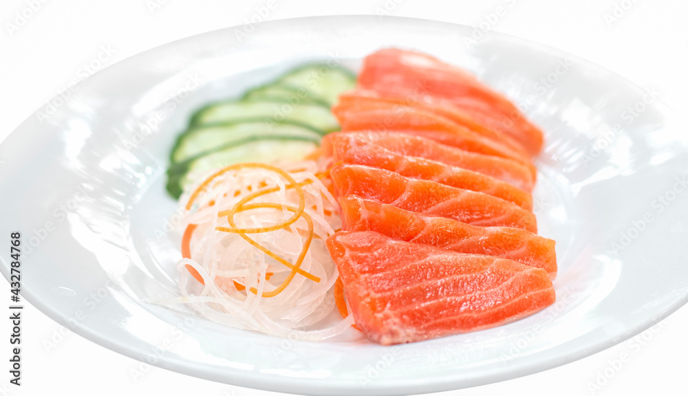 raw salmon red fish with vegetables on white plate raw salmon red fish with vegetables on white plate