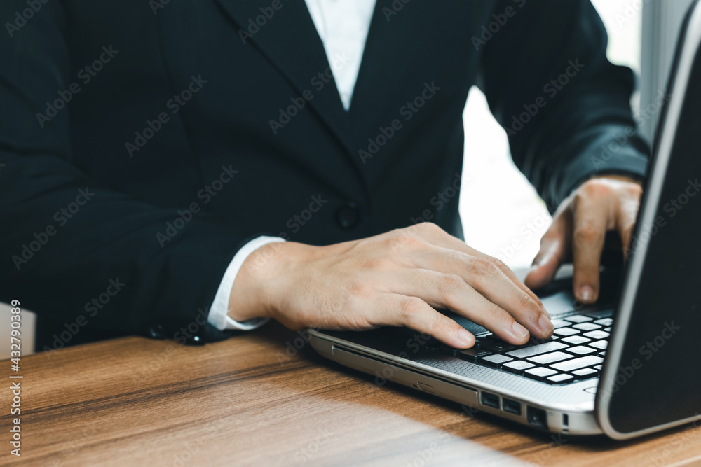 Businessman work with laptop computers on their desks in the office. Businessman work with laptop computers on their desks in the office.