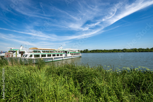 The Mantua Lake (Lago di Mezzo) or Mincio River with moored Ferry Boats in springtime. Mantova, Lombardy, Italy, southern Europe.