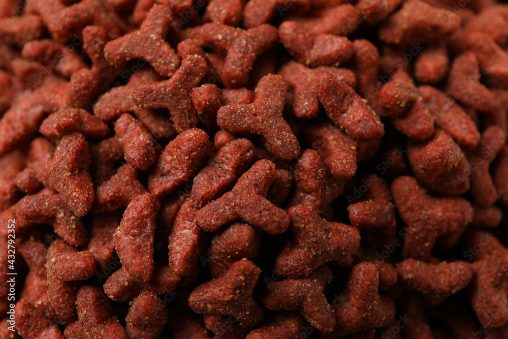 Red pet feed on whole background, close up Red pet feed on whole background, close up