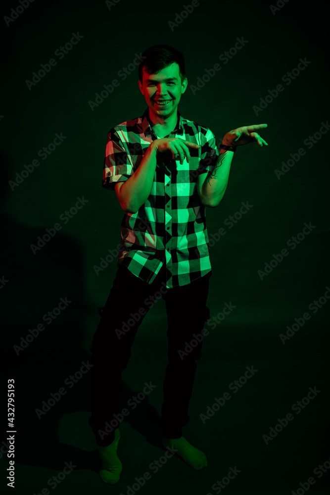 Emotional guy in the studio with green and red light Emotional guy in the studio with green and red light