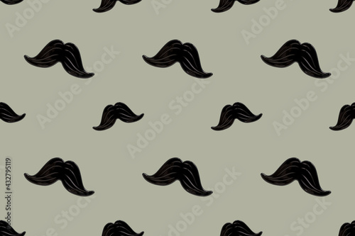 Hipster black mustache seamless pattern on a gray background. Happy father's day and masculinity concept. Retro stylish design for wrapping paper, fabrics, man textiles, clothes for a boy