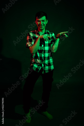 Emotional guy in the studio with green and red light