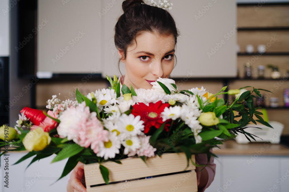 Close up portrait Caucasian woman enjoying flowers aroma. Woman's day flower bouquet. Beautiful woman face Close up portrait Caucasian woman enjoying flowers aroma. Woman's day flower bouquet. Beautiful woman face