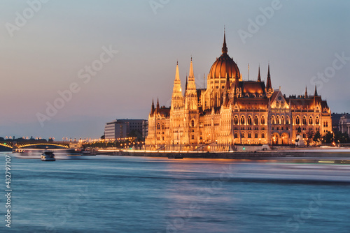Beautiful building of Parliament in Budapest, Hungary, a popular travel destination at sunset © Nikolett